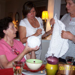 Lola and Maria examined and admired Karla's crochet project while enjoying dinner at Karla's home. Lola and Maria examined and admired Karla's crochet project while enjoying dinner at Karla's home.