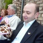 Lasha demonstrates the hand puppet he purchased for his little son. Lasha demonstrates the hand puppet he purchased for his little son.