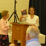 Solmaz presents a gift to Marcia, FFCNC President.
