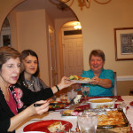 Marta R. served chicken pie to Judy G. while Fjolla looked on.