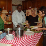 Folks dig into dinner made by Saburo.