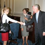 Natalia shakes hands with mayor, Allen Joines, while Carman Kosik, the group's translator, assists. Natalia shakes hands with mayor, Allen Joines, while Carman Kosik, the group's translator, assists.