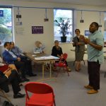 At Obama headquarters the delegation learns about community organizing. At Obama headquarters the delegation learns about community organizing.