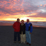 Jim N., Barbara N., and Ray K. enjoy sunset at Punakaikai on the South Island.