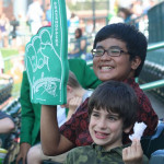 Rizky & host brother at baseball game.