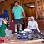 Repacking overweight suitcases - no smiles today.
