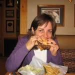 Elif enjoys a hamburger & fries.