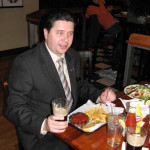 Aleksandr has a typical American lunch - cheeseburger and fries.
